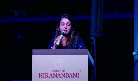 woman talking by a podium