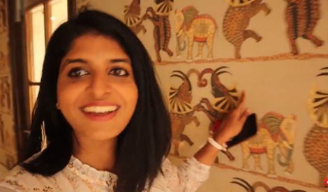 A woman pointing at wall art